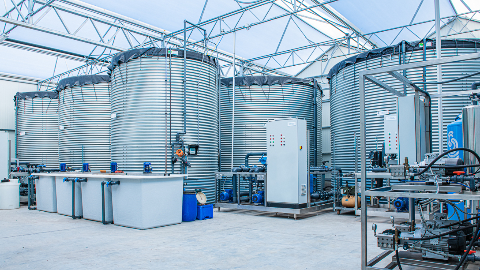 Water tanks installed indoors with pump equipment