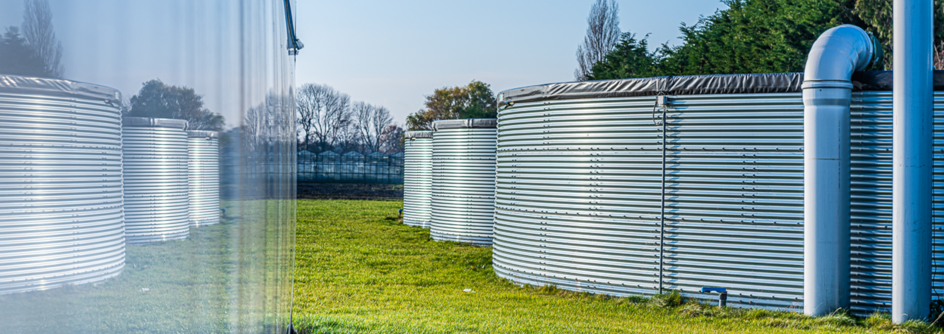 Three water tanks installed outdoors