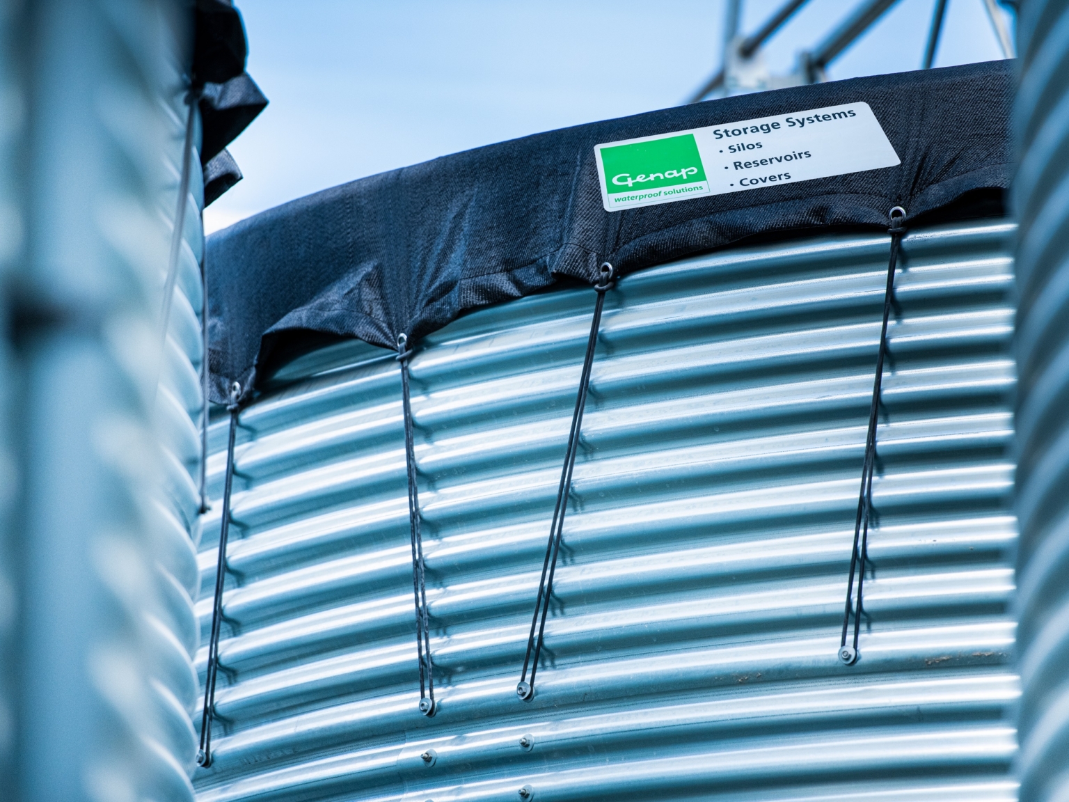 Close-up of water tank and tensioned cover