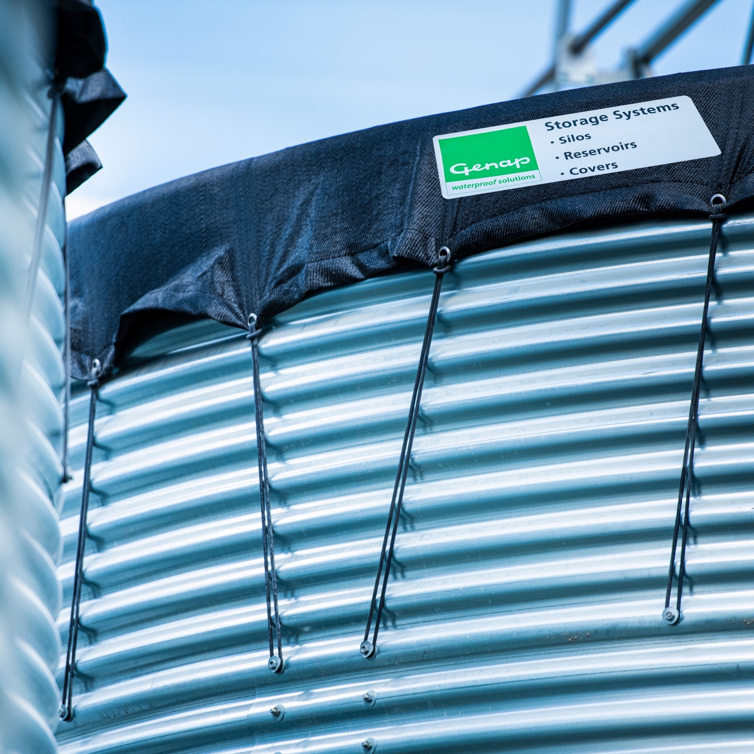 Close-up of water tank and tensioned cover