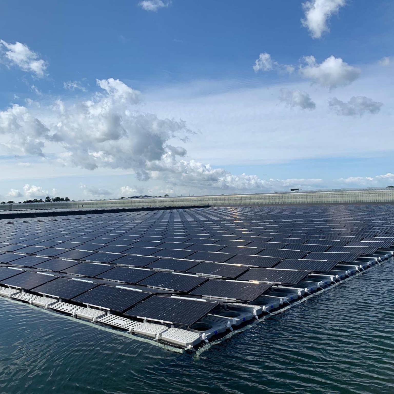 Sun-on-water solar panels installed in a water reservoir