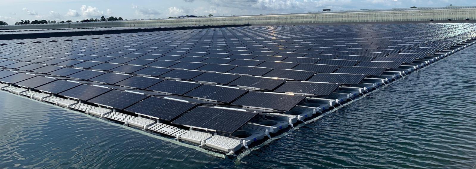 Sun-on-water solar panels installed in a water reservoir