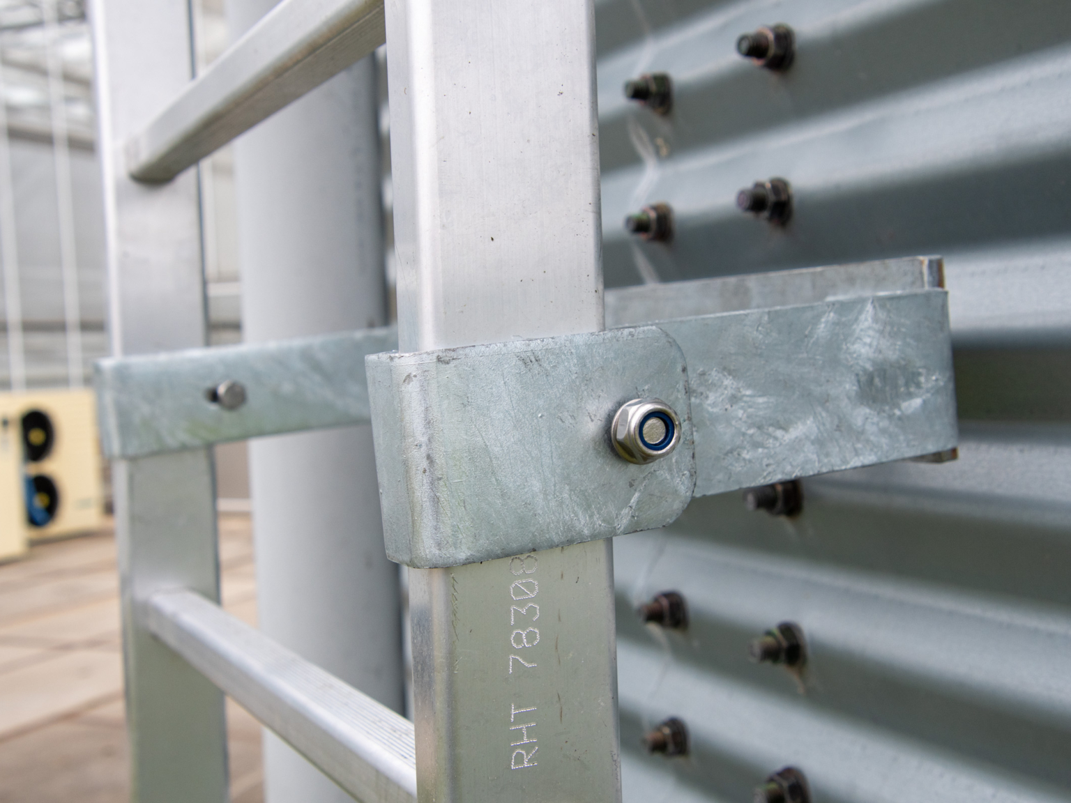 Close-up image of silo ladder mounting bracked