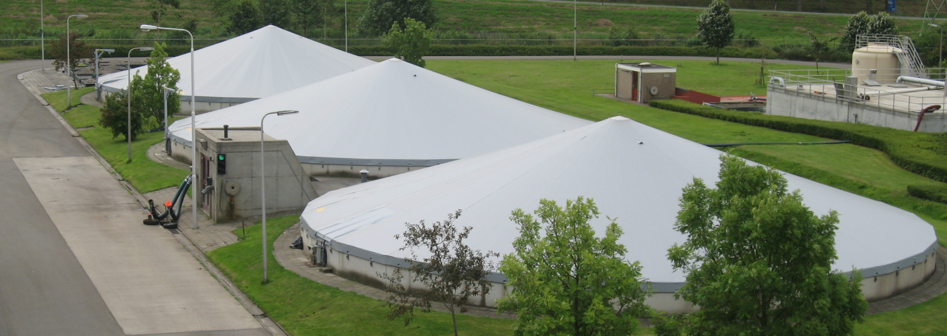 Three tensioned covers on buried silos