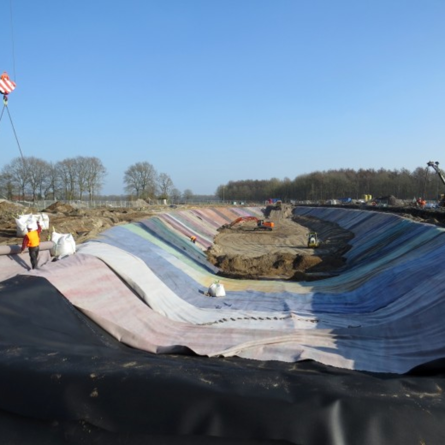 Various membranes being installed with the help of a crane